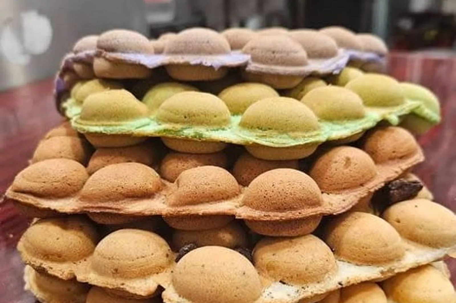 Stack of colorful egg puff waffles